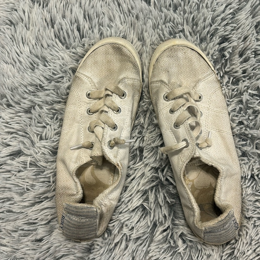 Worn white shoes